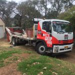 Our truck dropping off bins