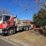 Our truck dropping off a bin